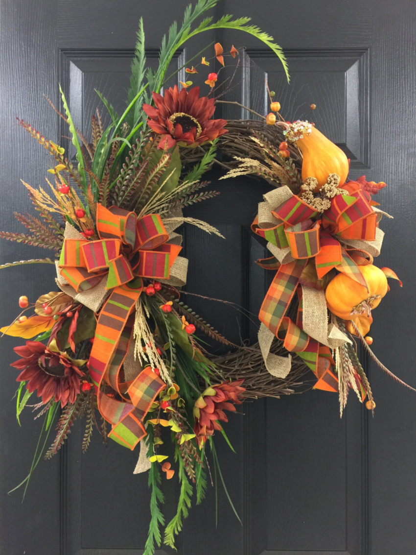 A gorgeous wreath like this will surely improve your front door. Source: Southern Home Accents